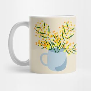 Mug and flower bouquet made of mimosa branches Mug